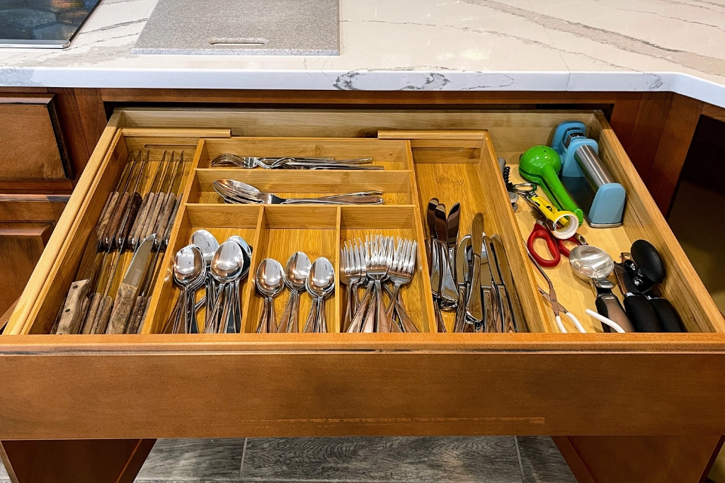 Kitchen drawer organized along with all cabinets, Destin Housekeeping Services vacation rental cleaning services.