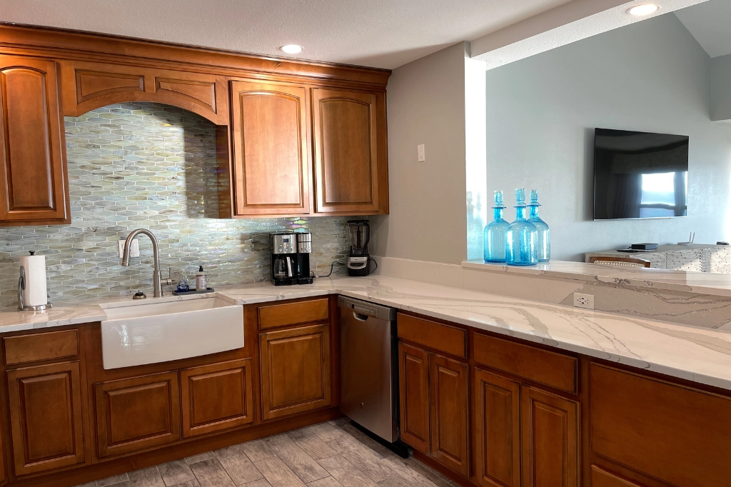 Destin Housekeeping Services, LLC - Housekeeper performing a deep clean in a vacation rental property.